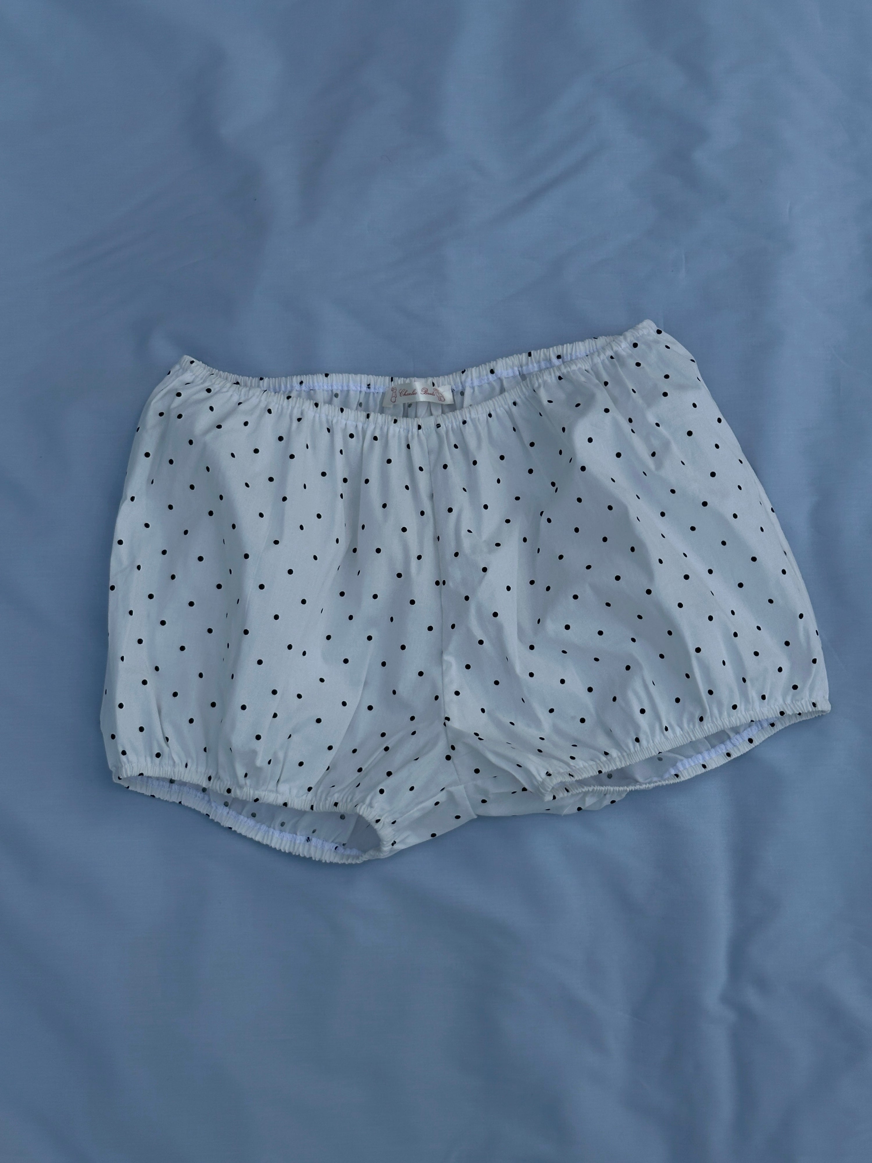 White babydoll bloomers with black polka dots made with upcycled deadstock cotton, soft women’s lounge shorts