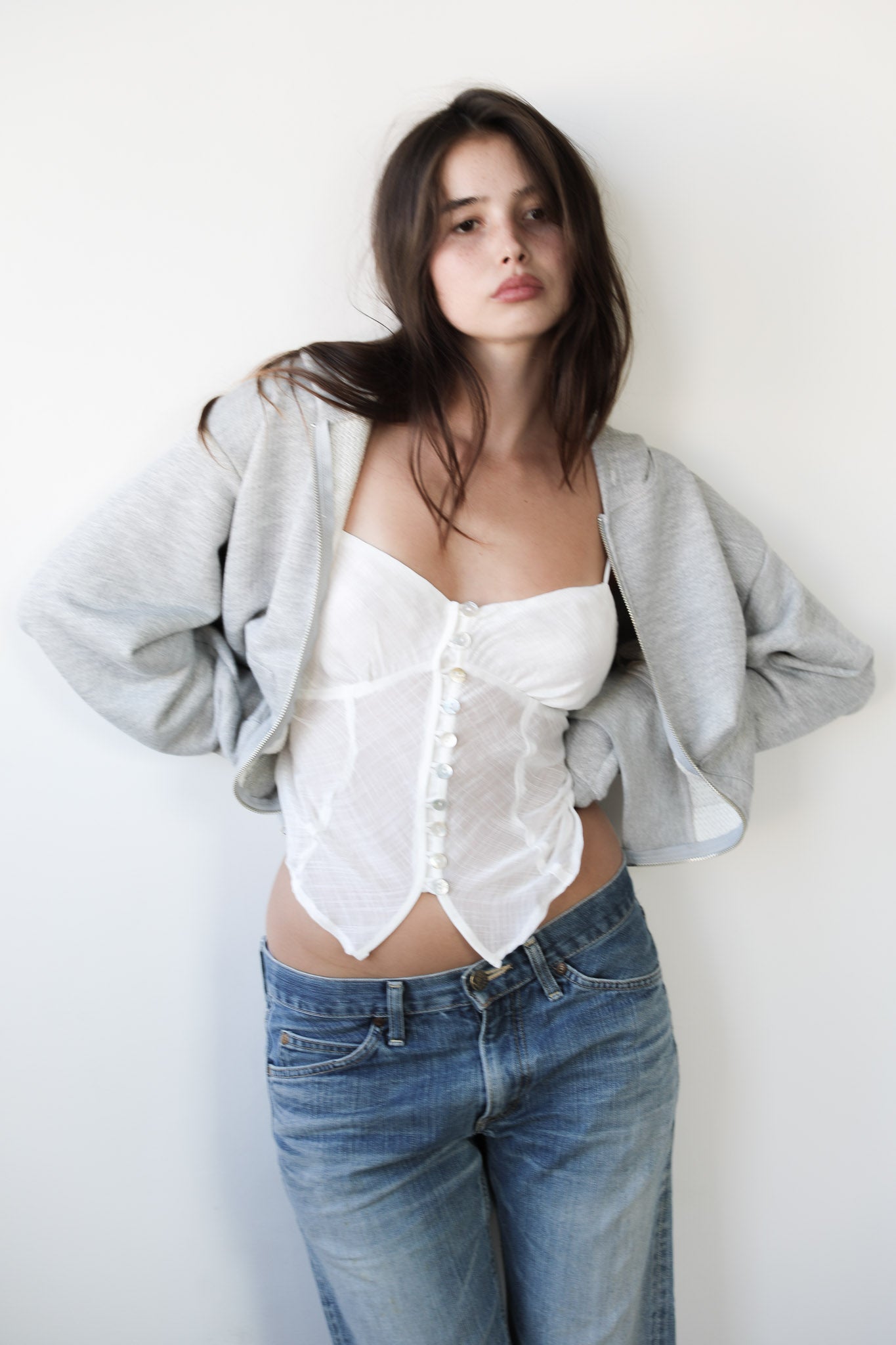 Women’s white ethereal tank top in upcycled cotton with pearl buttons and adjustable straps